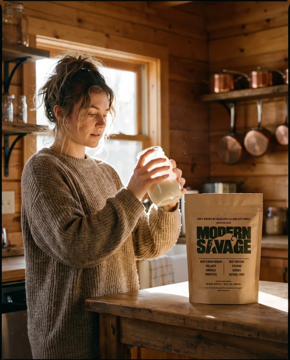 A woman in a cabin kitchen holding a shaker beside a Modern Savage pouch