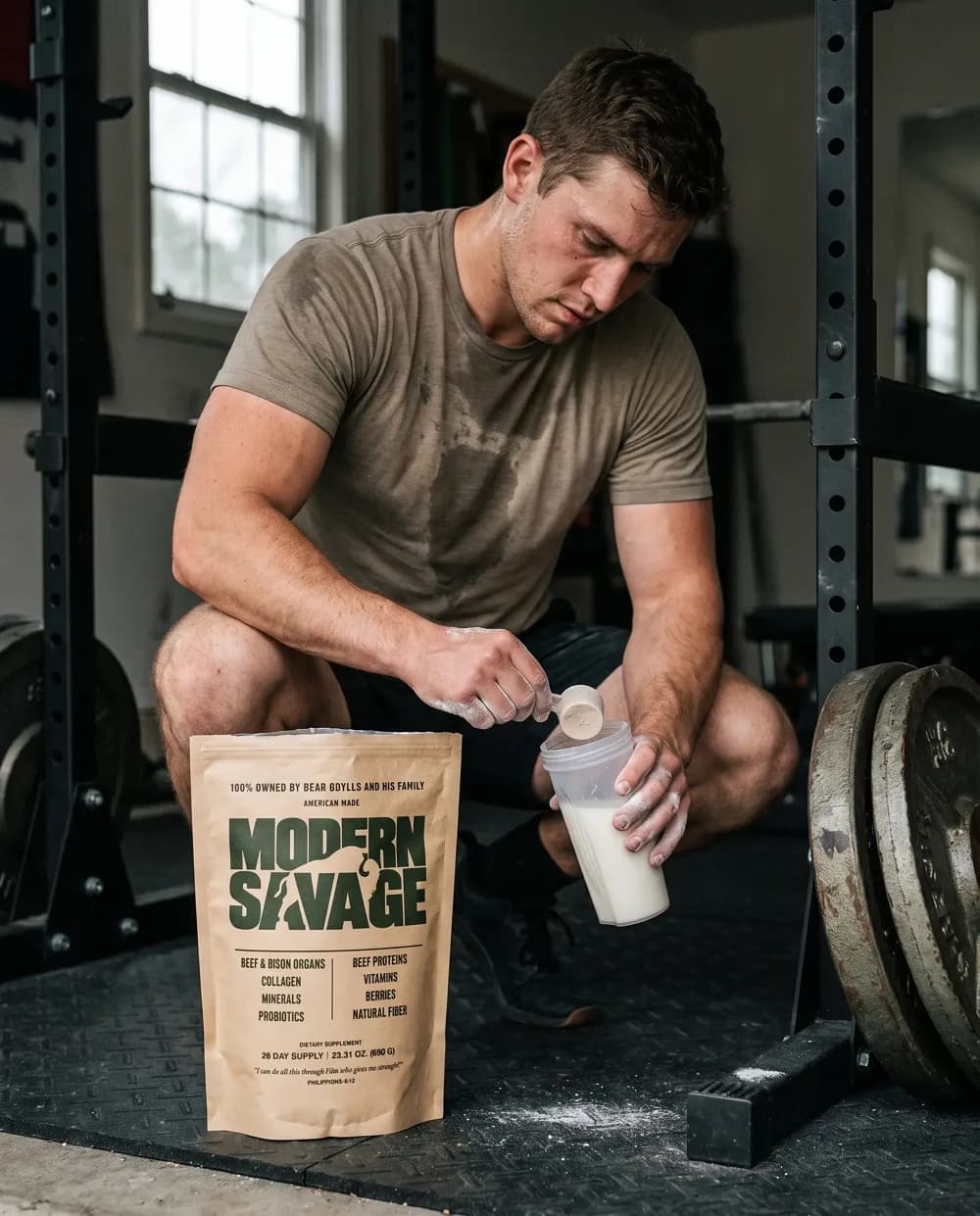 A man in a gym adding Modern Savage to a shaker